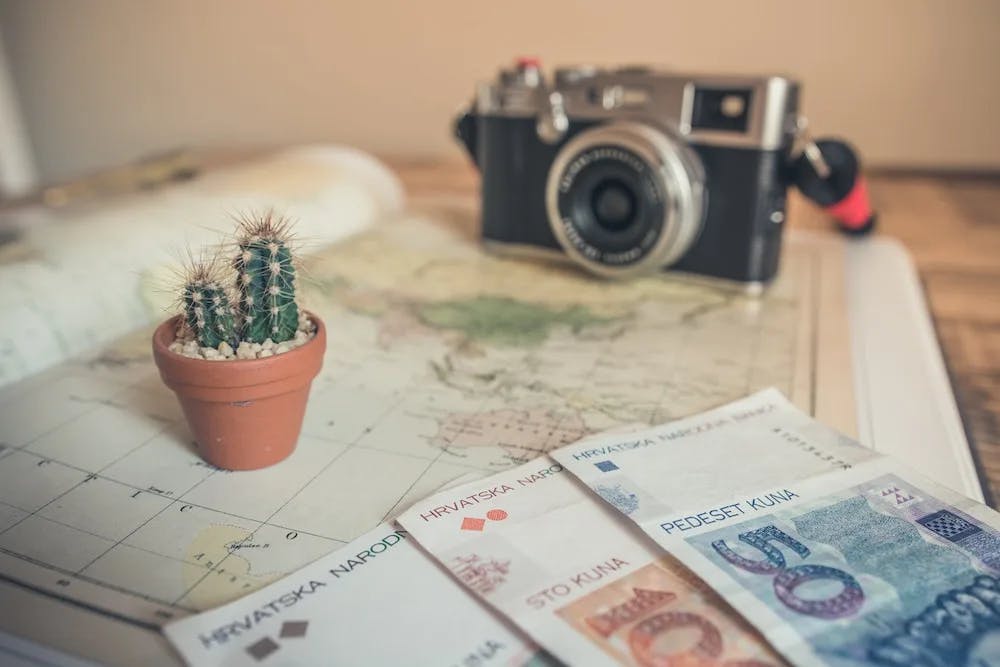Camera, money and map image