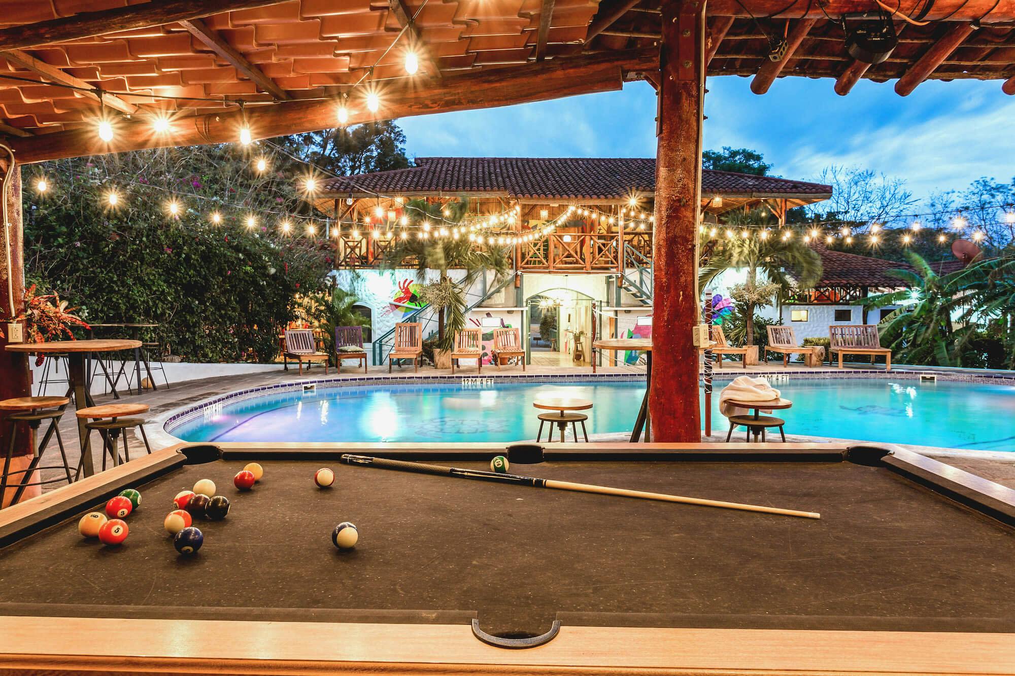 pool table next to outdoor pool