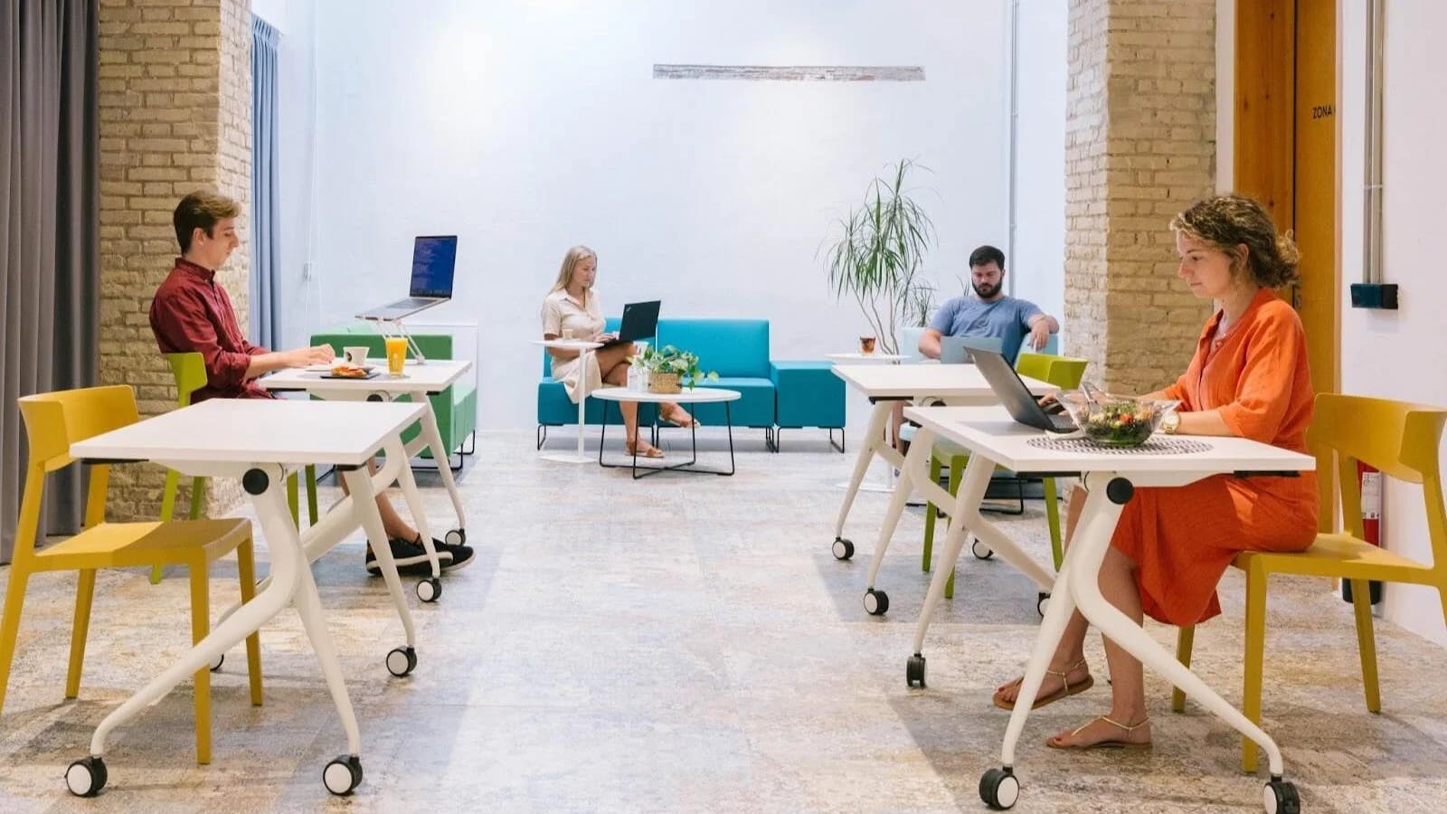 people sitting at desks in coworking space