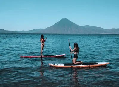 girls stand up paddle in guatemala